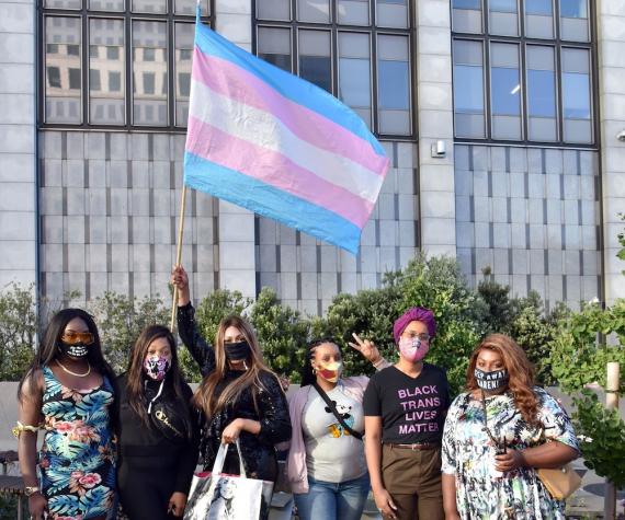 trans gender rights flag and line of epople
